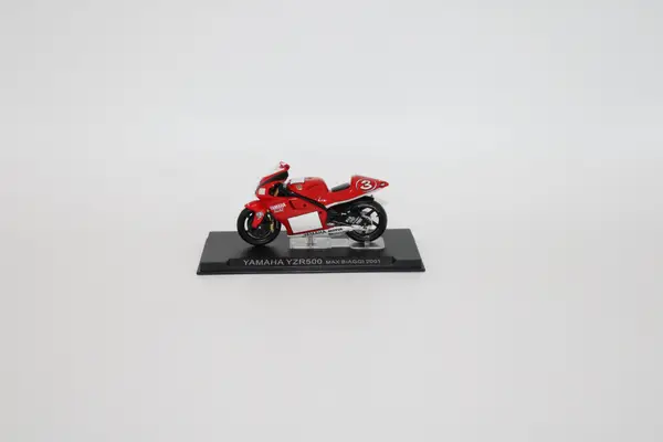 Deagostini red Yamaha YZR500 Max Biaggi 2001 No. 3 diecast motorcycle for sale on a stand.