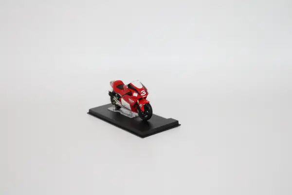 Deagostini red Yamaha YZR500 Max Biaggi 2001 No. 3 diecast motorcycle for sale on a stand.