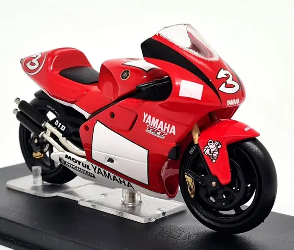 Deagostini red Yamaha YZR500 Max Biaggi 2001 No. 3 diecast motorcycle for sale on a stand.
